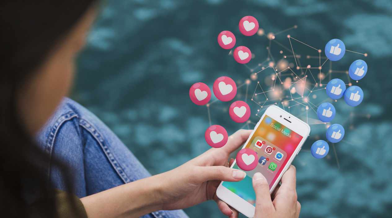 A girl using a smartphone to manage social media posts, illustrating storytelling success with likes and engagement.
