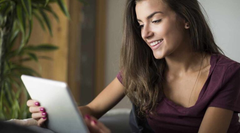 A laptop on a clean desk showing a business website that uses storytelling to connect with users.